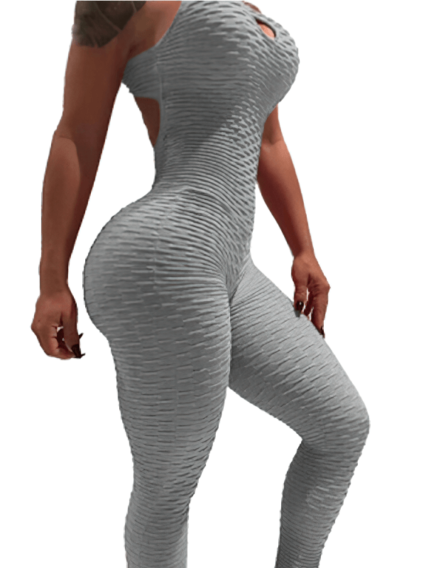 Women's textured open-back yoga jumpsuit in light grey, featuring a snug fit perfect for comfort and performance during yoga.